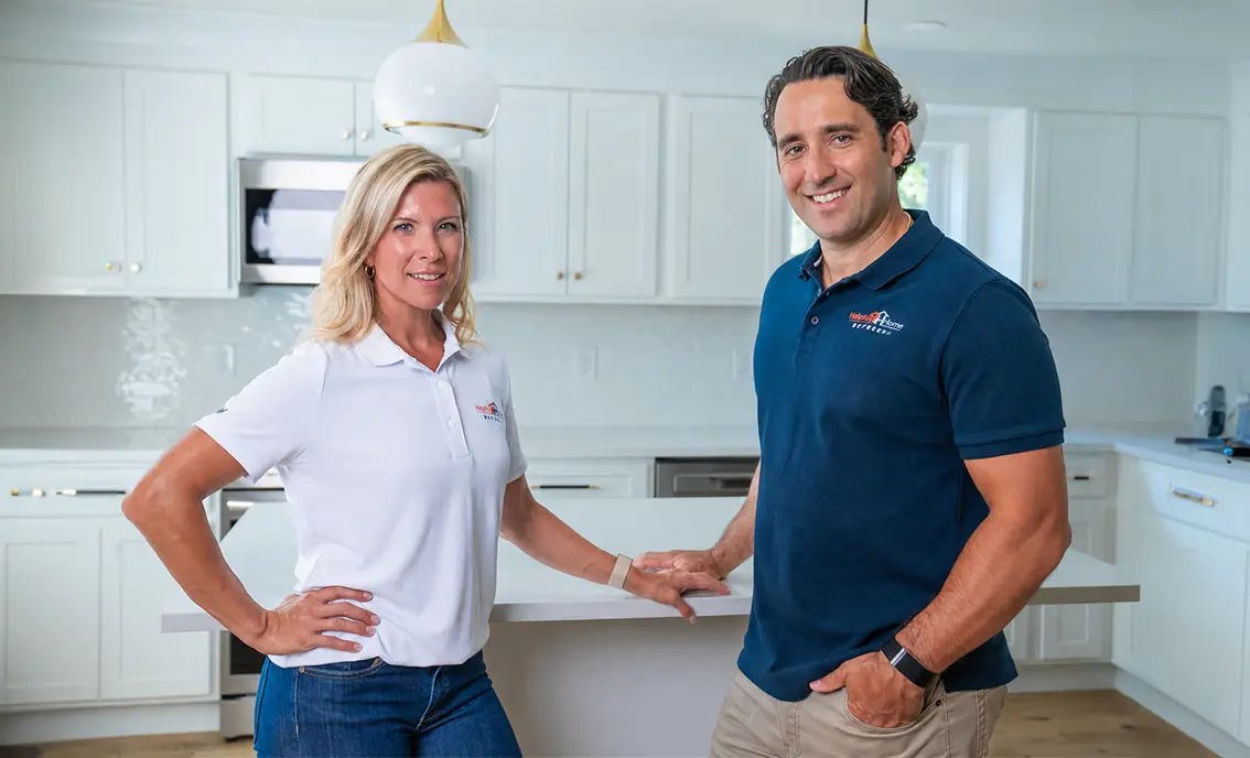 Helpful Home Buyers team standing inside a renovated Connecticut home, helping homeowners sell houses quickly for cash.